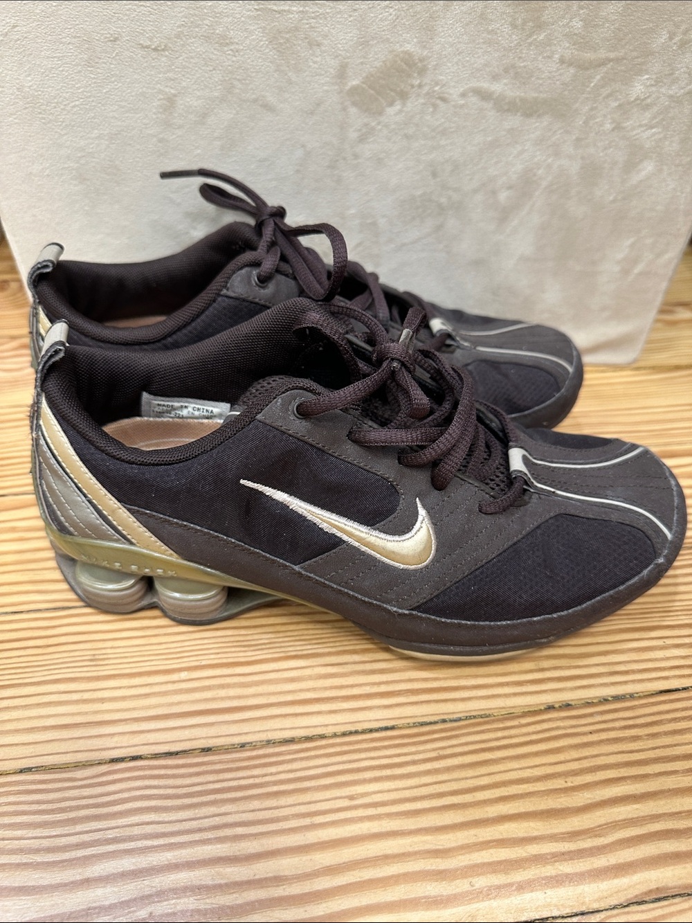 Nike Women's chocolate and light Gold Low-Profile women’s training sneakers